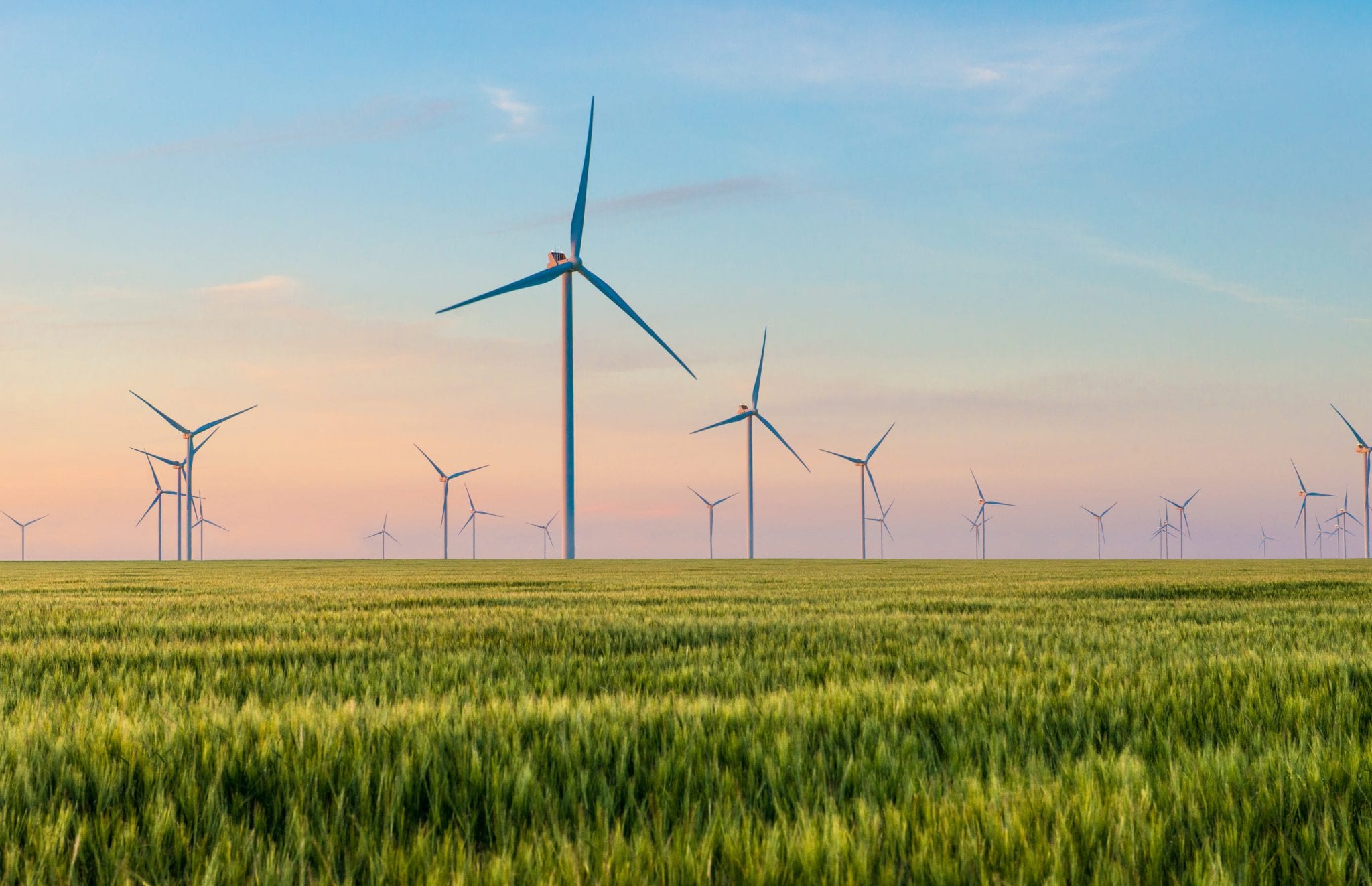 wind turbines in green field sustainablity investing